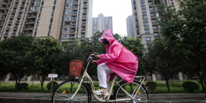 Slowdown. A resident cycles through an Evergrande community in Wuhan.