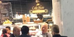 Surveillance photo of Daryl Maguire (left);with Charlie Demian (second from left with back to camera);Tim Lakos (white shirt);and Michael Hawatt (right,back to camera) at a Sydney cafe in May 2017.
