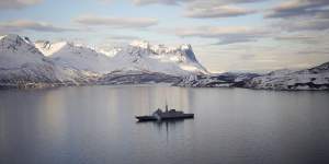 The French navy frigate Normandie patrols in a Norwegian fjord,north of the Arctic circle.