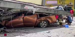 A screengrab from a video uploaded to social media shows damage to a vehicle and building in Vanuatu after a magnitude-7.3 earthquake on Tuesday.