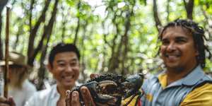 Juan Walker (right) from Walkabout Adventures with the now-famous mud crab.