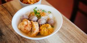 Bakso malang bihun soup,bakso beef balls with siu mai dumplings and deep fried chicken prawn balls and rice noodles.