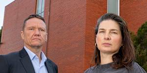 Parents James Rankin and Hannah Marshall outside Collingwood College,which has water damage on the whole top floor.