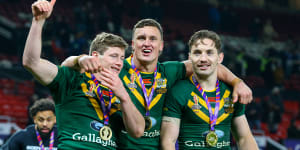Australia’s Harry Grant,Jack Wighton and Cameron Murray after winning the Rugby League World Cup at Old Trafford on November 19,2022.