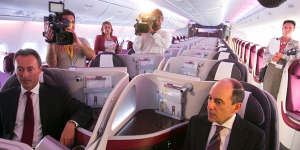 Akbar Al Baker (right),CEO of Qatar Airways,sits in the business class cabin inside the airline’s first Airbus A380.