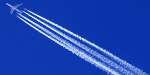 A Qatar Airways Airbus A 340 airplane leaves contrails in the sky.