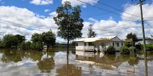 Floodwater lingers after 30 suburbs hit with more than 1 metre of rain