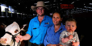 Kierin and Nikki Martin,pictured with 14-month-old son Riley,are exhibiting the Hereford cattle at the Melbourne Royal Show.