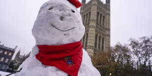 A snowman with the backdrop of the Victoria Tower in Westminster,in London,on Monday.