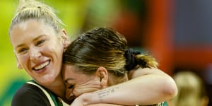 Lauren Jackson hugs Opals teammate Cayla George at the Olympics qualifying event in Brazil.
