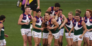 The Dockers celebrate a goal in their retro jersey worn in round 20 last season.