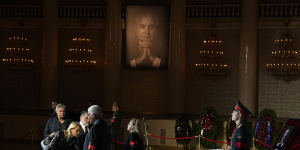 People walk past the coffin of Mikhail Gorbachev inside the Pillar Hall of the House of the Unions