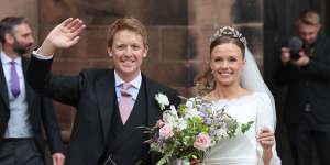 Hugh Grosvenor,Duke of Westminster and Olivia Grosvenor,Duchess of Westminster wave and smile to well-wishers after their wedding ceremony.