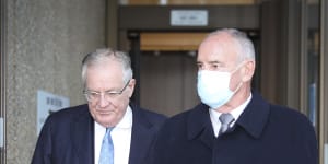 Chris Dawson (right) leaves the NSW Supreme Court with his solicitor,Greg Walsh,on Tuesday,May 24,2022.