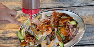 The finished torre de mariscos,ready to be piled onto tostadas. Swipe to see how the seafood tower is assembled.