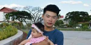 Anucha Angkaew,a Thai farm worker captured by Hamas from an Israeli kibbutz on October 7. He is pictured with his daughter,who is now 7.