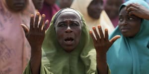 A woman prays for the kidnapped students in Kuriga,Nigeria.