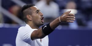 Nick Kyrgios points out distractions in the crowd during his match against Steve Johnson.