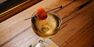 The Banh M(artini) features roast pork and pâté fat-washed vodka,gin,vermouth,and coriander oil.