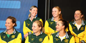Taylah Preston (middle,second row) with Billie Jean King Cup Australian captain Sam Stosur (bottom left) and her teammates in Brisbane.