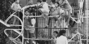 Happiness is a crowded climbing frame:Max Naglazas (back to the camera) fights for a space in a park in Hospitalet de Llobregat.