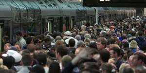 Crowds wait for trains at Olympic Park station on September 23,2000.