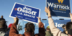 Joe Biden is travelling to Georgia to support Democratic Georgia Senate challenger the Reverend Raphael Warnock,seen here at a rally with Jon Ossoff in Atlanta.