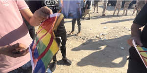 A rainbow flag helped by a protester outside the Swedish embassy in Baghdad.