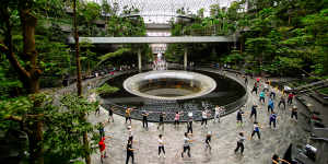 Locals practice tai chi at Singapore’s Changi Airport.