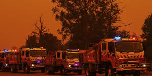 Fire trucks in Buxton as the Green Wattle Creek fire approaches the town.
