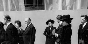 The Queen (second from left) speaks with the exiled Duchess of Windsor at Edward VIII’s funeral in London.