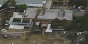 Hospital damaged,patients evacuated after construction equipment crashes through roof