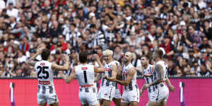 Jack Ginnivan celebrates a goal in front of the Collingwood faithful.