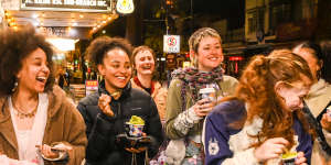 Young patrons enjoying Acland Street’s night-time vibe on Thursday.