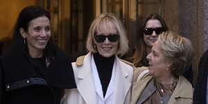 E. Jean Carroll leaves court after being awarded damages.