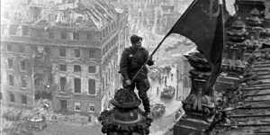 Soviet soldiers hoisting the red flag over the Reichstag in Berlin in May 1945