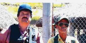 Joaquin"El Chapo"Guzman,left,poses with an unidentified man. 
