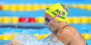Abbey Harkin cast injury aside to feature at the World Aquatics Championships.