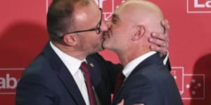 Andrew Barr kisses his partner Anthony Toms on election night.