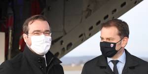 Slovak Prime Minister Igor Matovic,right,and Health Minister Marek Krajci oversee the arrival of a shipment of the Russian vaccine Sputnik V into Slovakia.