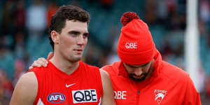 Tom McCartin (left) with older brother Paddy after the Anzac Day game in Launceston.