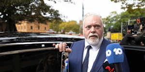 Kyle Sandilands was thronged by the media as he left court.
