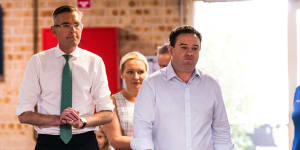 Premier Dominic Perrottet and Stuart Ayres on the campaign trail in Penrith on Friday.