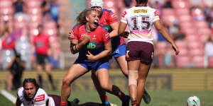 Knights prop Caitlan Johnston celebrates her try.