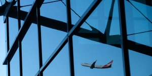 Qantas’ new spending will hurt profits,with brokers downgrading the company’s share price target.