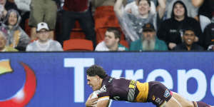 Reece Walsh scores for the Brisbane Broncos against the Canberra Raiders.