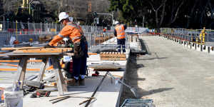 Construction workers at a stop for the light rail line on Wansey Road near Randwick Racecourse.