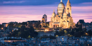 Marvel at the top of the steps at Sacre Coeur before enjoying dinner at Montmartre.