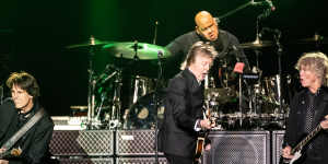 Paul McCartney rips it up on stage with the band at Allianz stadium. 