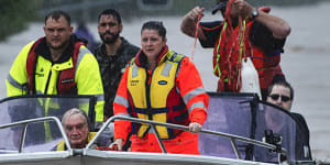 Locals in fishing boats help with rescue efforts in Lismore.